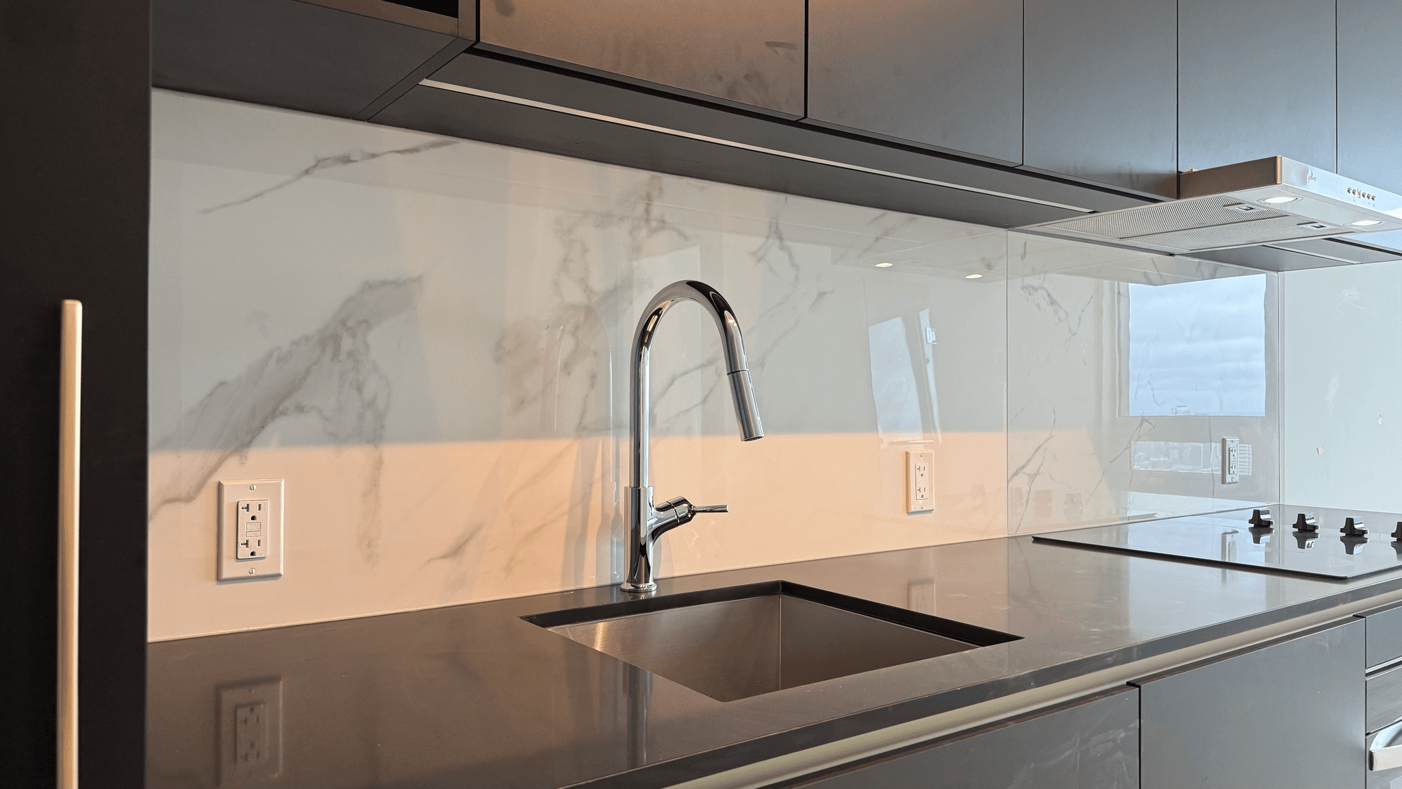 Finished dark slab backsplash